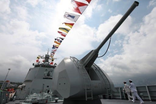 The gun of Chinese missile destroyer Haikou (171) is seen in Hong Kong, in April. China is exploiting Western commercial technology, carrying out aggressive cyber espionage and buying more anti-ship missiles as part of a steady build-up of military power, the Pentagon reported on Friday