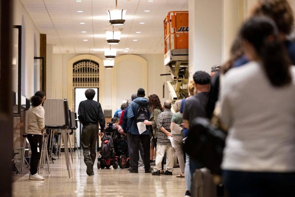 Voters who need to make corrections to their mail-in ballots line up at Philadelphia's City Hall on the eve of the midterm elections, in Philadelphia, Pennsylvania, on November 7, 2022.