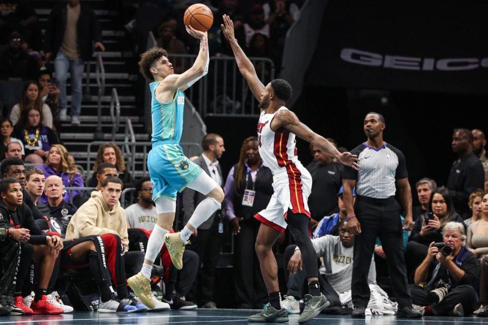Hornets guard LaMelo Ball (1) shoots over Heat guard Haywood Highsmith (24)during the game at Spectrum Center on Tuesday, November 14, 2023 in Charlotte, NC.