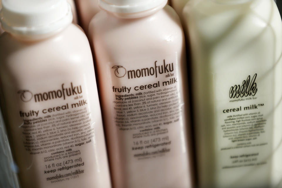 In this Thursday, Feb. 21, 2013 photo, cereal milk and fruity cereal milk is displayed at Milk Bar in New York. Cereal is going out of the box. Milk, ice cream, muffin mix and more are being infused with the flavor of the classic childhood treat. (AP Photo/Seth Wenig)