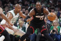 Miami Heat center Bam Adebayo (13) is pressured byBoston Celtics center Al Horford, left, during the second half of Game 4 of the NBA basketball playoffs Eastern Conference finals, Monday, May 23, 2022, in Boston. (AP Photo/Charles Krupa)