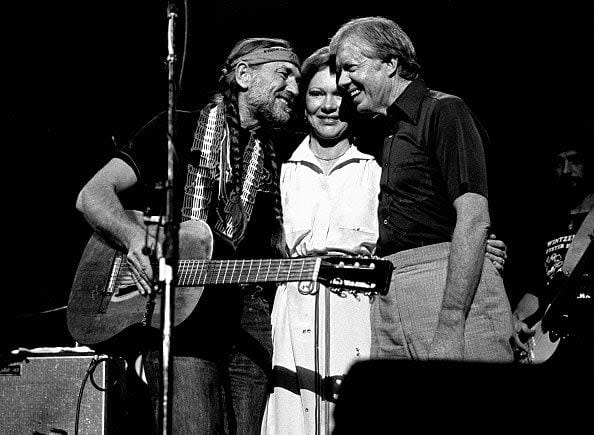 ATLANTA - December 12: Former President Jimmy Carter with Former First Lady Rosalynn join Willie Nelson and perform at The Omni Coliseum in Atlanta Georgia. December 12, 1982  (Photo By Rick Diamond/Getty Images)