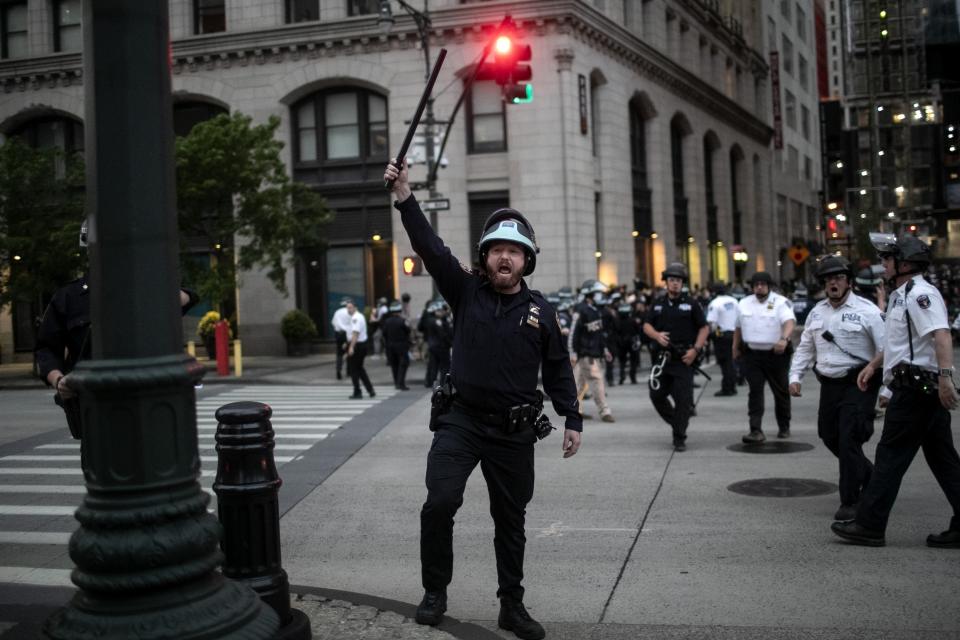 Police look for people who did not get off the street after the start of curfew Tuesday, June 2, 2020, in New York, during a protest over the death of George Floyd. Floyd died after being restrained by Minneapolis police officers May 25. (AP Photo/Wong Maye-E)