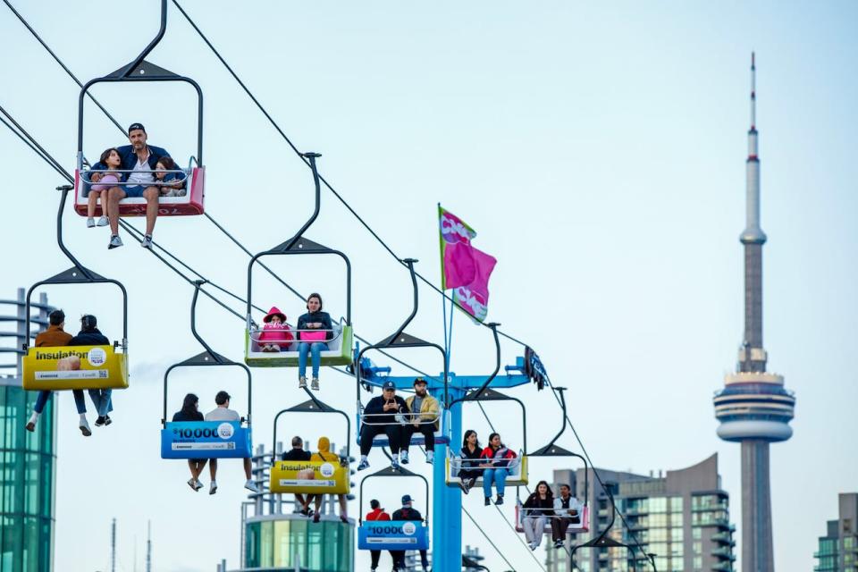 Fairgoers are pictured on the midway on the first day of the CNE, in Toronto, on Aug. 18, 2023.