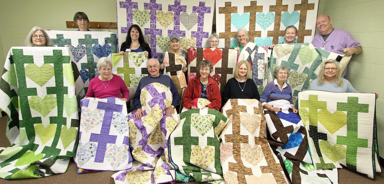 Cleveland County Hospice vice president Rachel Hill, second from left in back row, poses with members of the Foothill Quilters Guild which donated several handmade quilts to the Cleveland County Hospice Tuesday morning, March 28, 2023, at Ascension Lutheran Church in Shelby.