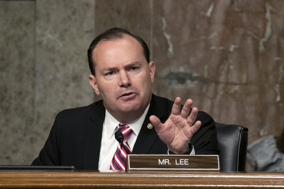 FILE - In this Sept. 30, 2020 file photo, Sen. Mike Lee, R-Utah, speaks during a Senate Judiciary Committee hearing on Capitol Hill in Washington to examine the FBI "Crossfire Hurricane" investigation. Hours after President Donald Trump announced he had tested positive for the coronavirus, Lee revealed he too had been infected with the disease. (Stefani Reynolds/Pool via AP, File)