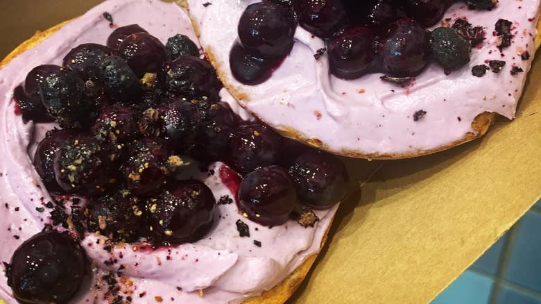 Bagel with spread and blueberries