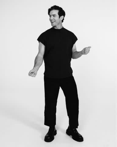 <p>Mark Elzey</p> The Row, Courtesy of SSENSE top. Dickies pant. Louis Vuitton boots.