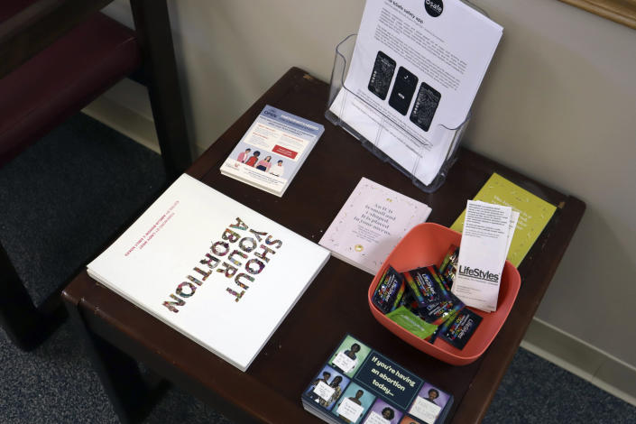 Pamphlets and other resources on abortion care sit on a table in the empty waiting room of the Women's Health Center of West Virginia on Wednesday, June 29, 2022 in Charleston, W.Va. After the U.S. Supreme Court ruling that overturned Roe v. Wade, the clinic had to suspend abortion services because of an 1800s-era abortion ban in West Virginia state code. (AP Photo/Leah Willingham)