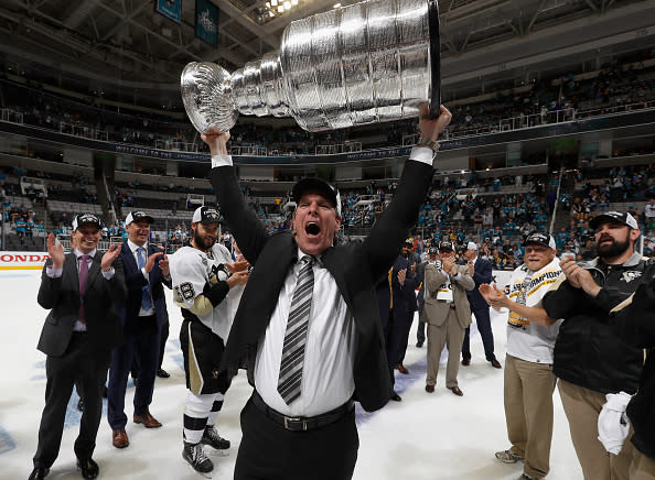 SAN JOSE, CA - JUNE 12: Head coach Mike Sullivan of the Pittsburgh Penguins celebrates with the Stanley Cup after the Penguins won Game 6 of the 2016 NHL Stanley Cup Final over the San Jose Sharks at SAP Center on June 12, 2016 in San Jose, California. The Penguins won the game 3-1 and the series 4-2. (Photo by Gregory Shamus/NHLI via Getty Images)