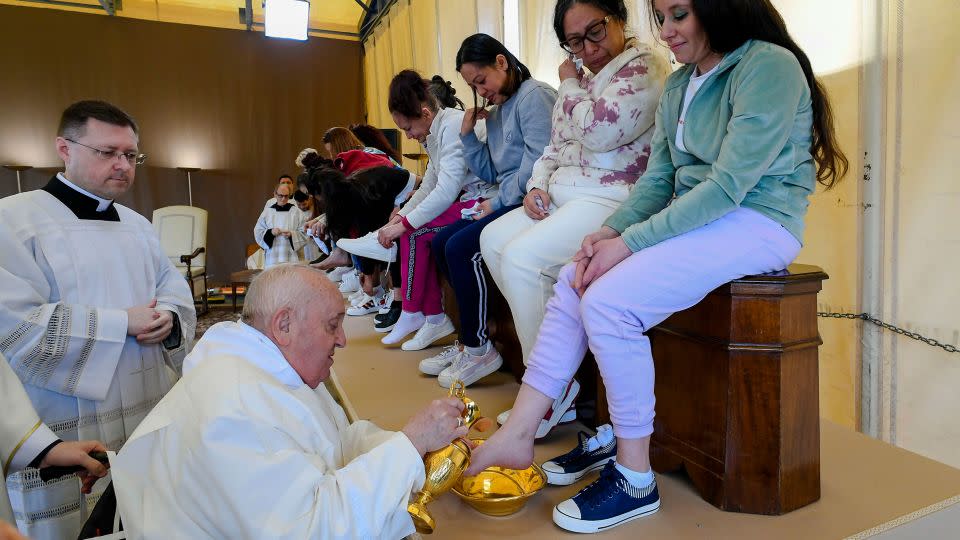 Pope Francis washes and kisses the feet of 12 women inmates of the Rebibbia prison on the outskirts of Rome on Holy Thursday, March 28, 2024, a ritual meant to emphasize his vocation of service and humility. - Vatican Media via AP