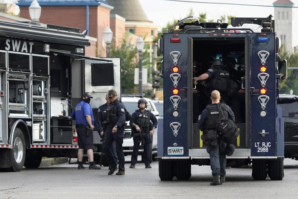 Police work near the scene of a shooting Saturday, Aug. 29, 2020, in St. Louis. The St. Louis Police Department says two of their officers have been shot and a suspect is believed to be barricaded in a house nearby. (AP Photo/Jeff Roberson)