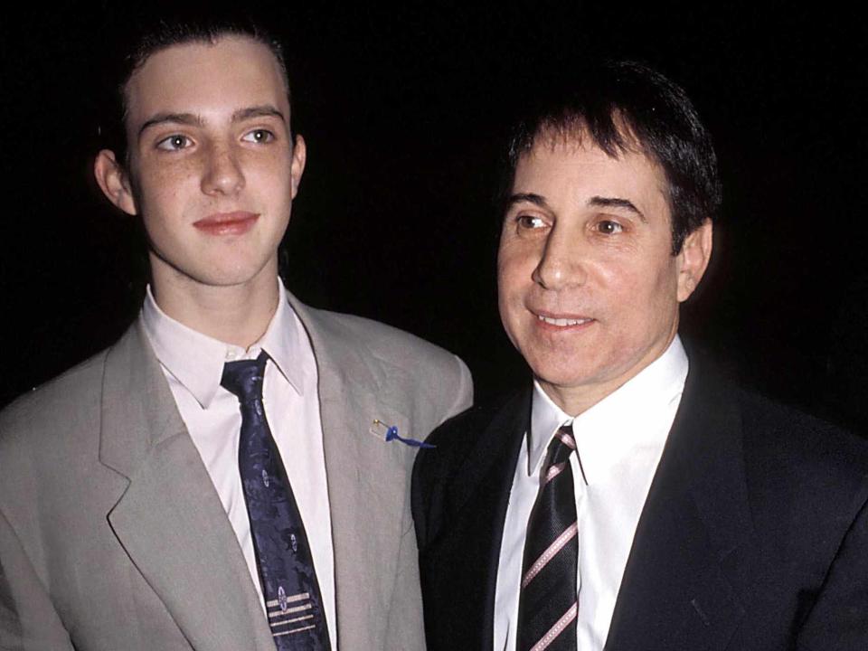 <p>Judie Burstein/Globe Photos/ZUMA Press/Alamy</p> Paul Simon and his son, Harper 