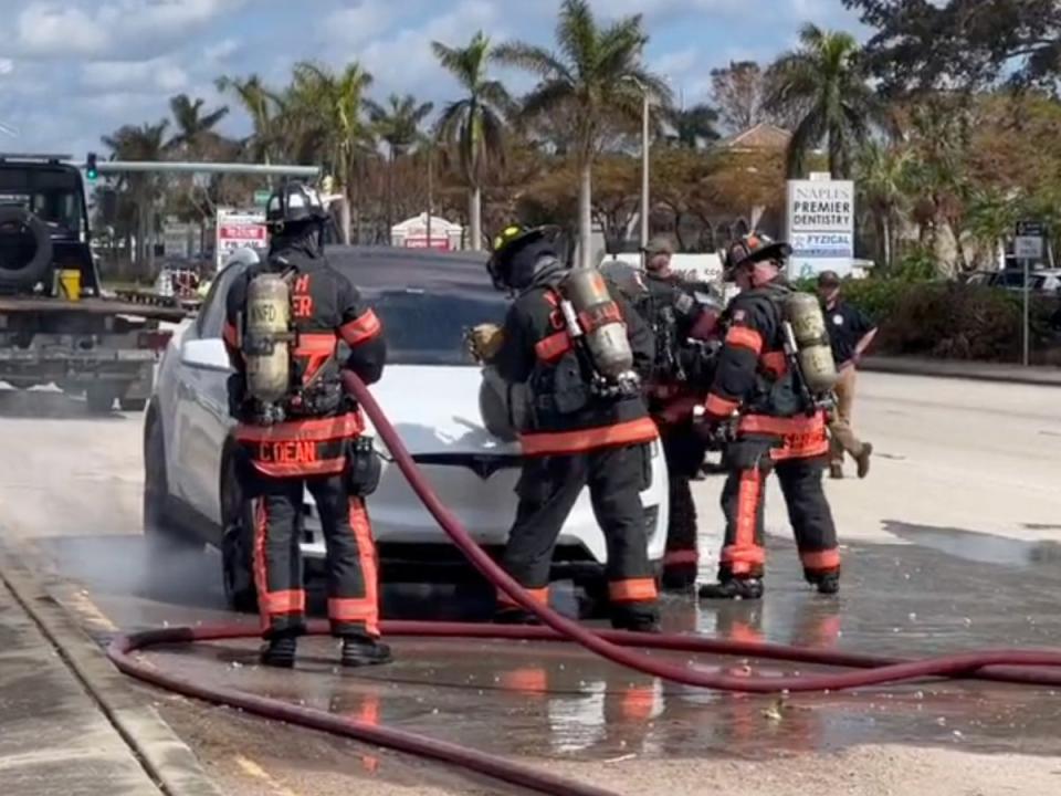 Firefighters in Florida attempt to put out a Tesla fire prompted by Hurricane Ian (Screenshot / Twitter / Jimmy Patronis)