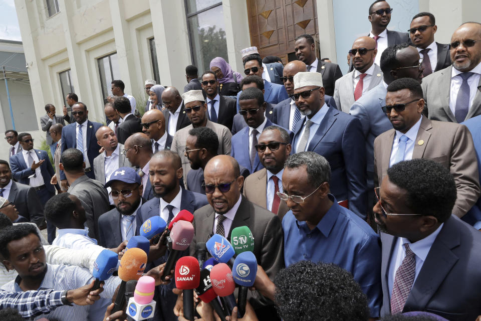 Somalia members of parliament address the media outside parliament buildings in Mogadishu, Somalia, Wednesday, Feb 21, 2024. Somalia announced a defense deal with Turkey to deter Ethiopia's access to sea through a breakaway region. Ethiopia signed a memorandum of understanding with Somaliland on Jan. 1. The document has rattled Somalia, which said it's prepared to go to war over it because it considers Somaliland part of its territory. (AP Photo/Farah Abdi Warsameh)