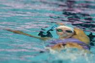 Regan Smith swims on her way to winning the 100-meter backstroke at the U.S. national championships swimming meet, Friday, June 30, 2023, in Indianapolis. (AP Photo/Darron Cummings)