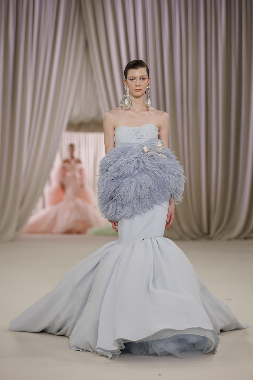 A model wears a creation as part of the Giambattista Valli Haute Couture Spring-Summer 2023 collection presented in Paris, Monday, Jan. 23, 2023. (AP Photo/Lewis Joly)