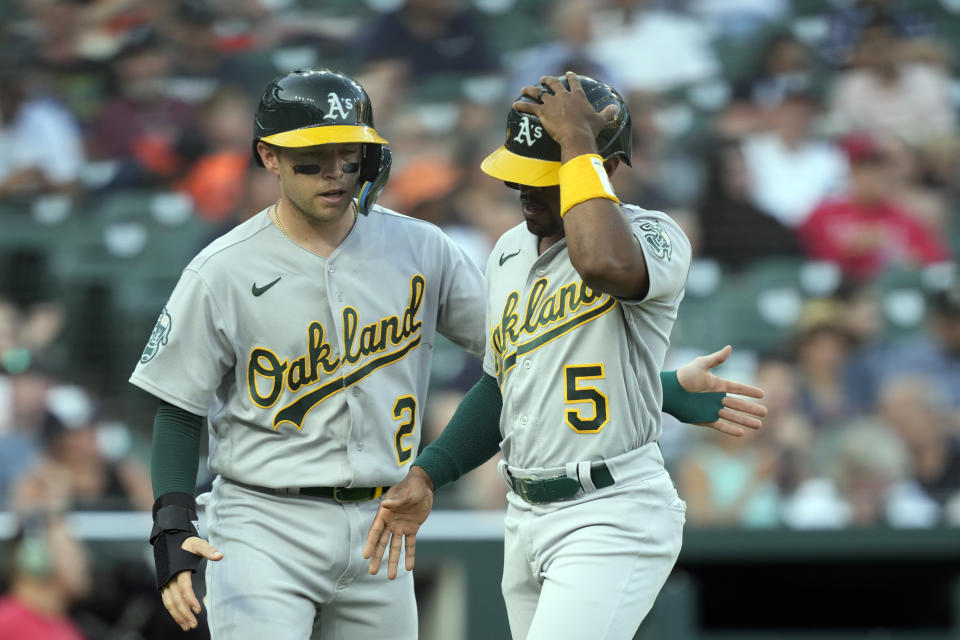 Oakland Athletics' Nick Allen (2) greets Tony Kemp (5) after they both scored on Esteury Ruiz's single during the sixth inning of a baseball game against the Detroit Tigers, Wednesday, July 5, 2023, in Detroit. (AP Photo/Carlos Osorio)