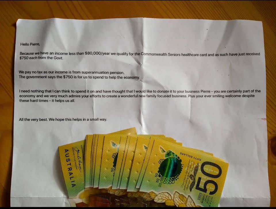 A picture of a note and $750 in $50 notes.