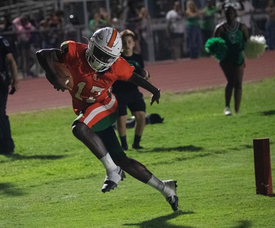 Javirin Singleton of Dunbar runs in the final touchdown on Friday, Sept. 15, 2023, at Dunbar High School. Dunbar went for two on the next play and won 40-39 in double overtime.