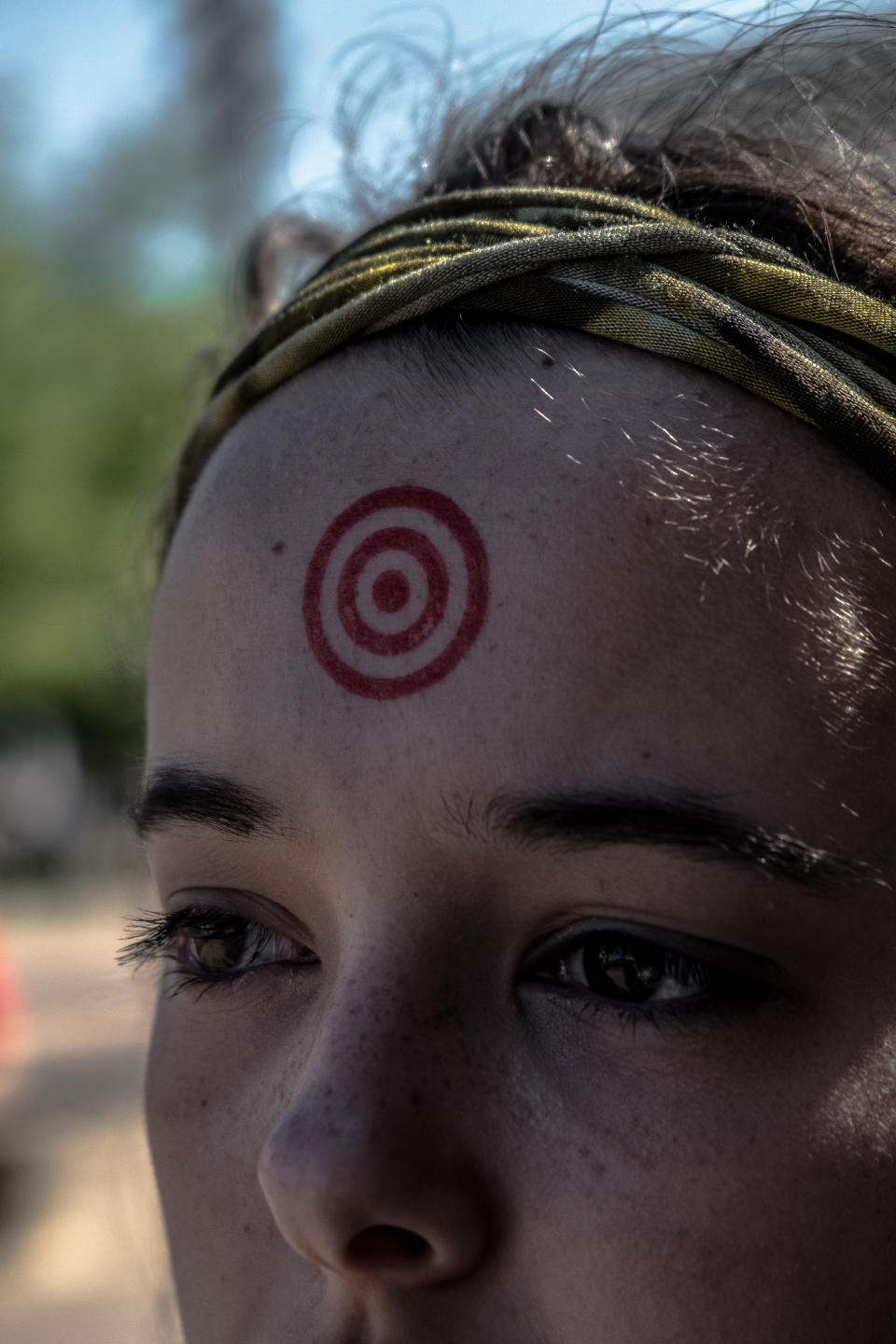 Julia Heilrayne, a student at Austin High School, stands with a target painted on her head at&nbsp;a gun control rally&nbsp;outside Dallas City Hall on&nbsp;Saturday.