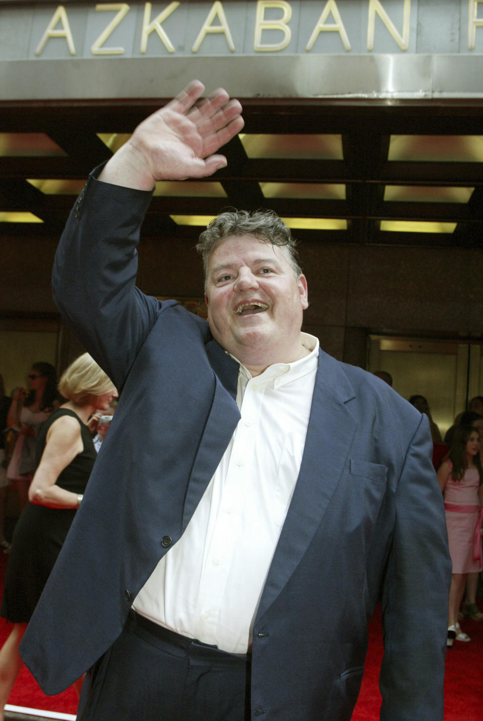 FILE - Robbie Coltrane walks the red carpet during the New York premiere of "Harry Potter and the Prisoner of Azkaban" Sunday, May 23, 2004. Scottish actor Robbie Coltrane, who played a forensic psychologist on TV series “Cracker” and the giant Hagrid in the “Harry Potter” movies, has died. He was 72. Coltrane’s agent Belinda Wright said he died Friday Oct. 14, 2022, at a hospital in Scotland. (AP Photo/Diane Bondareff, File)