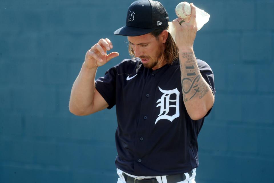Detroit Tigers pitcher Michael Lorenzen warms up before throwing at Spring Training Sunday, February 19, 2023.   Lorenzen wears his Christianity on his sleeve Galations 2:20 is a favorite scripture he wears it on his left arm and got it as a rookie.