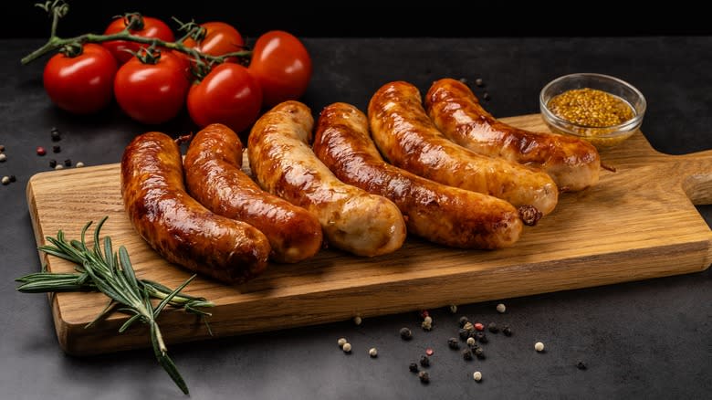 Sausages on chopping board