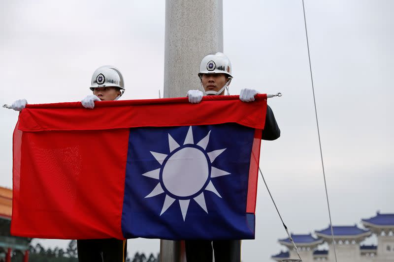 Military honour guards attend a flag-lowering ceremony at Chiang Kai-shek Memorial Hall in Taipei