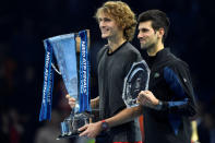 Tennis - ATP Finals - The O2, London, Britain - November 18, 2018 First placed Alexander Zverev of Germany and second placed Novak Djokovic of Serbia celebrate with their trophies after the final Action Images via Reuters/Tony O'Brien