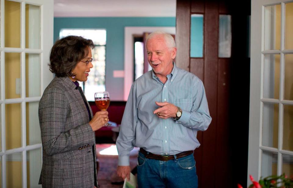 Myrick Howard, president of Preservation North Carolina, and Juanita Shearer-Swink socialize during an event in November 2014 for the book “Cameron Park, A Remote Retreat on Hillsboro Street, 1920 to 2010.”
