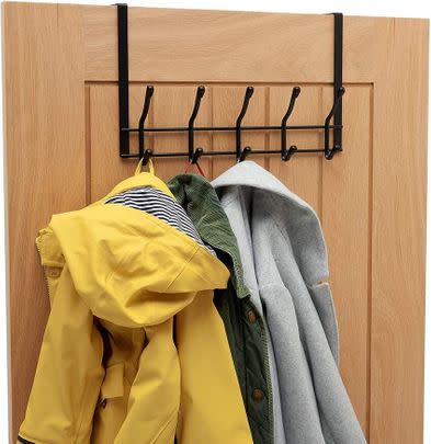 A handy rack for hanging coats and bag over the door