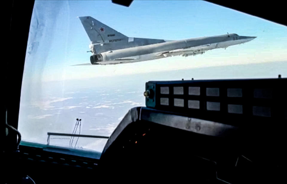 In this photo taken from video and released by the Russian Defense Ministry Press Service on Saturday, Feb. 5, 2022, A view of a Tu-22M3 bomber of the Russian air force seen from the cockpit of another such plane during a training flight. Two Tu-22M3 long-range bombers of the Russian air force performed a patrol mission over Belarus on Saturday amid the tensions over Ukraine. (Russian Defense Ministry Press Service via AP)