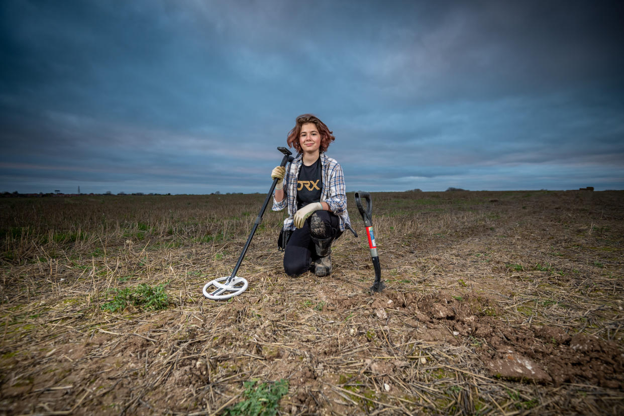 Milly Hardwick,13 with her metal detector out in a field near her home in Suffolk