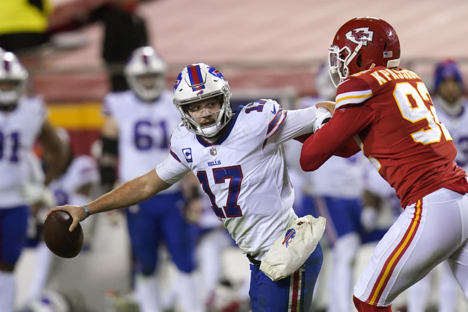 Buffalo Bills quarterback Josh Allen (17) is sacked by Kansas City Chiefs defensive end Tanoh Kpassagnon, right, during the second half of the AFC championship NFL football game, Sunday, Jan. 24, 2021, in Kansas City, Mo. (AP Photo/Orlin Wagner)