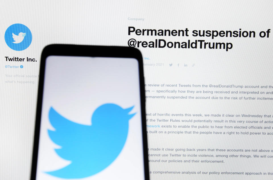 UKRAINE - 2021/01/11: In this photo illustration, a &#39;Permanent suspension of @realDonaldTrump&#39; message seen on a Twitter website in front of a mobile phone with a Twitter logo. 
Twitter permanently suspended the account of Donald Trump, reportedly by the media. (Photo Illustration by Pavlo Gonchar/SOPA Images/LightRocket via Getty Images)
