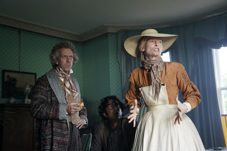 This image released by Fox Searchlight Pictures shows Hugh Laurie, from left, Dev Patel and Hugh Laurie in a scene from the film "The Personal History of David Copperfield." (Dean Rogers/Fox Searchlight Pictures via AP)