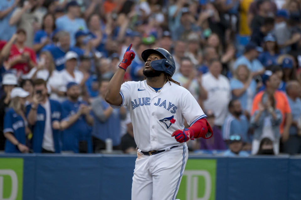 Toronto Blue Jays first baseman Vladimir Guerrero Jr. (27) celebrates after his home run against the Philadelphia Phillies during the fourth inning of a baseball game, Wednesday, July 13, 2022 in Toronto. (Christopher Katsarov/The Canadian Press via AP)