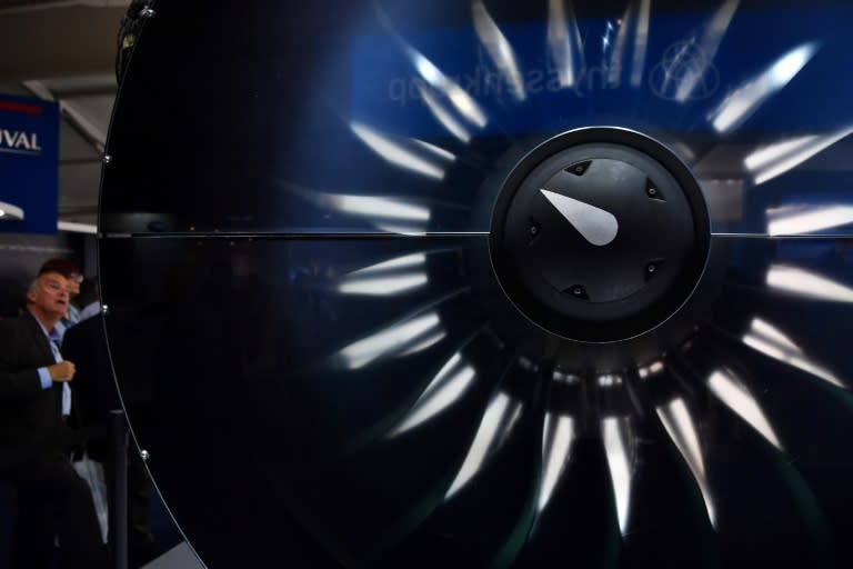 A visitor looks at a Pratt & Whitney engine during the Farnborough Airshow, in Britain in July 2018 (BEN STANSALL)