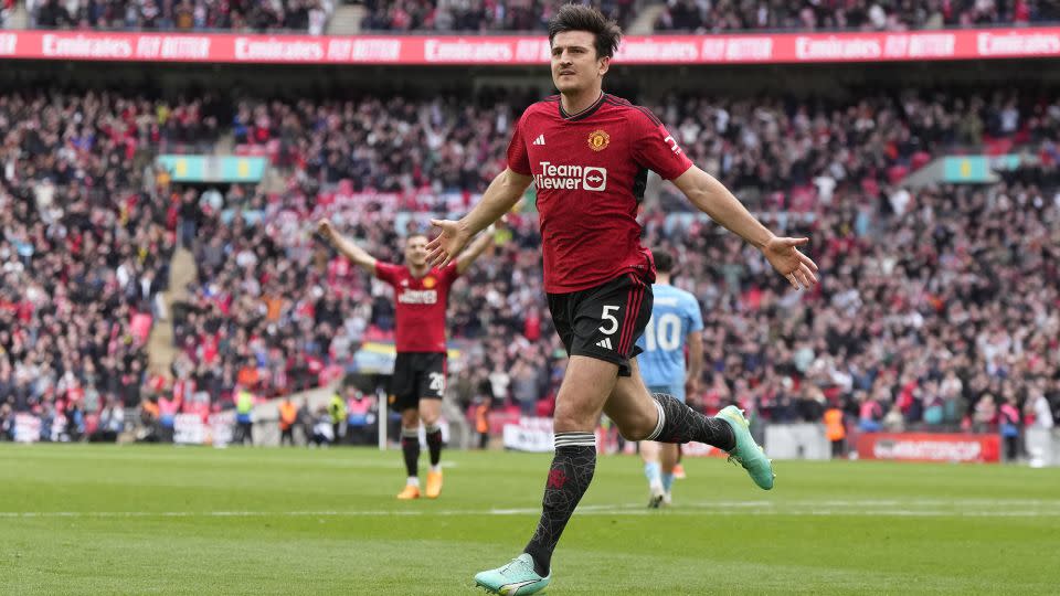 Manchester United's Harry Maguire celebrates after scoring his side's second goal. - Alastair Grant/AP