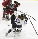 Montreal's Mikyla Grant-Mentis, left, collides with Minnesota's Kelly Pannek (12) during the first period of a PWHL hockey game Thursday, April 18, 2024, in Montreal. (Christinne Muschi/The Canadian Press via AP)