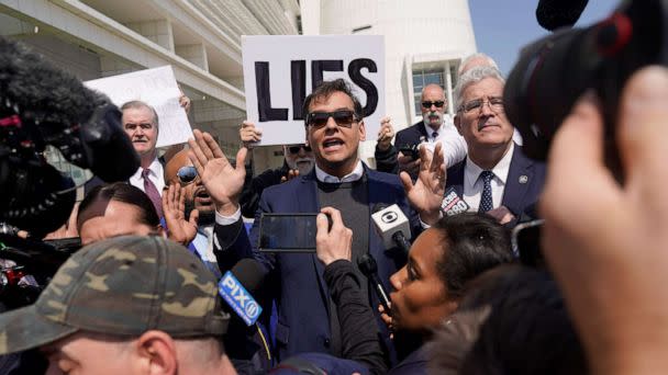 PHOTO: U.S. Rep. George Santos speaks to reporters outside of the federal courthouse in Central Islip, N.Y., May 10, 2023. (Seth Wenig/AP)