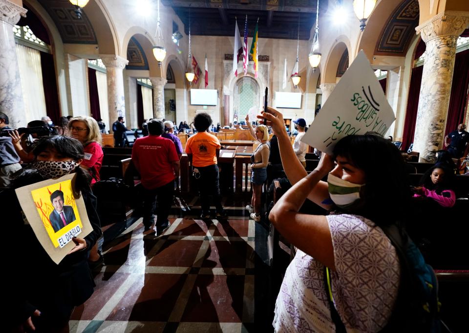 Protesters disrupt the start of a Los Angeles City Council meeting on Oct. 12, 2022.