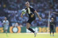 Real Madrid's Gareth Bale jumps to control the ball during La Liga soccer match between Celta and Real Madrid at the Balaídos Stadium in Vigo, Spain, Saturday, Aug. 17, 2019. (AP Photo/Luis Vieira)