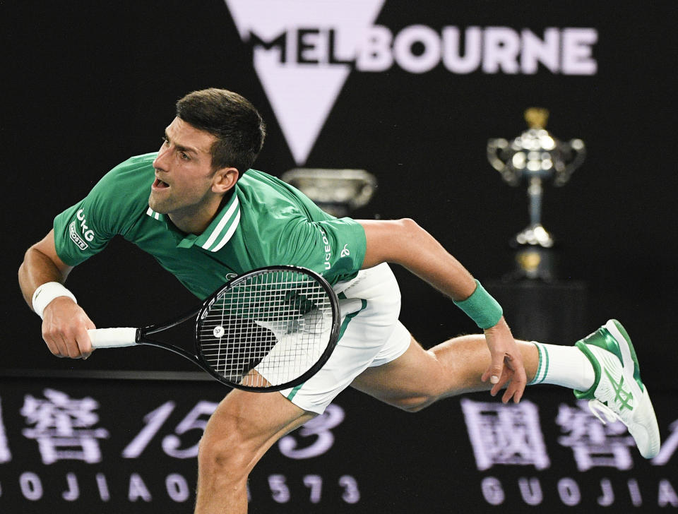 Serbia's Novak Djokovic serves to Germany's Alexander Zverev during their quarterfinal match at the Australian Open tennis championship in Melbourne, Australia, Wednesday, Feb. 17, 2021.(AP Photo/Andy Brownbill)