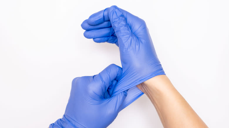 pair of blue disposable gloves