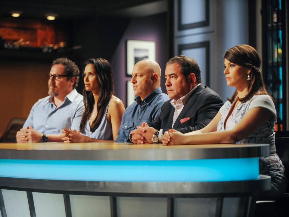 Padma Lakshmi with the other judges of "Top Chef," sitting at the judges' table