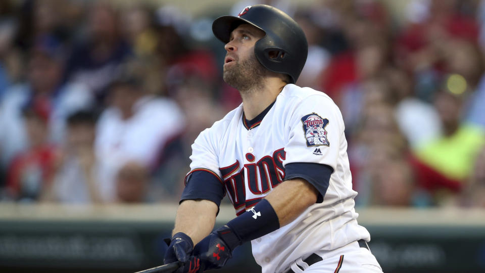 Minnesota Twins' Brian Dozier bats against the Kansas City Royals'in the first inning of a baseball game Tuesday, July 10, 2018, in Minneapolis. (AP Photo/Jim Mone)