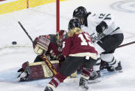 Boston's Taylor Wenczkowski (12) scores on Montreal goaltender Ann-Renee Desbiens (35) during the third overtime of a PWHL playoff hockey game in Laval, Quebec, Saturday, May 11, 2024. (Christinne Muschi/The Canadian Press via AP)