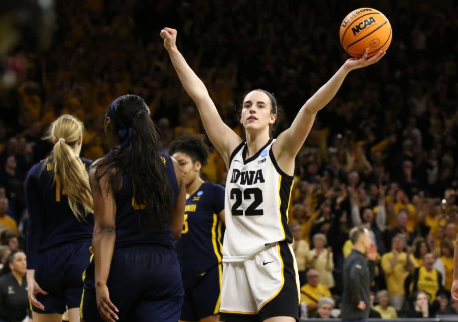 Caitlin Clark #22 of the Iowa Hawkeyes celebrates as time runs out in the second half against the West Virginia Mountaineers during their second round match-up in the 2024 NCAA Division 1 Women’s Basketball Championship at Carver-Hawkeye Arena on March 25, 2024 in Iowa City, Iowa. (Photo by Matthew Holst/Getty Images)